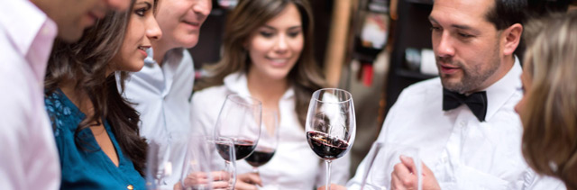 Young people enjoying a wine tasting event.